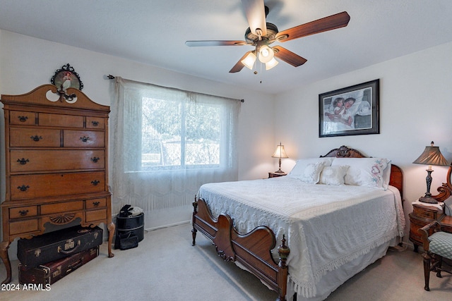 bedroom featuring ceiling fan and light colored carpet