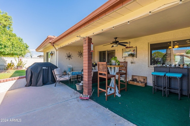 view of patio featuring ceiling fan and a grill