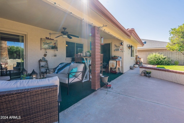 view of patio featuring an outdoor living space and ceiling fan