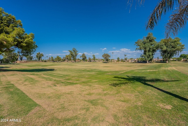 view of property's community with a lawn