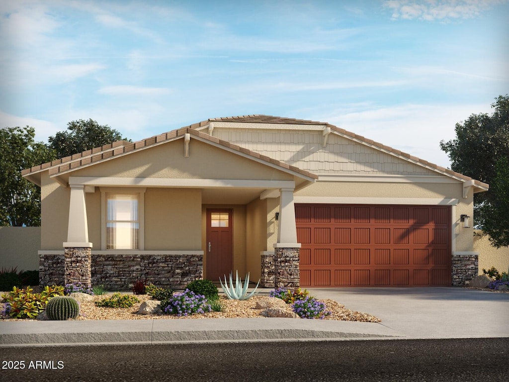 craftsman-style home with a garage, stone siding, driveway, and stucco siding