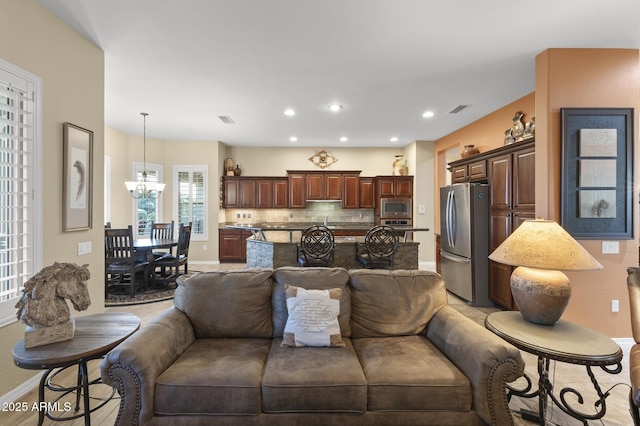 living room with an inviting chandelier