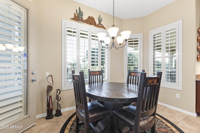 dining space with light tile patterned floors and a chandelier