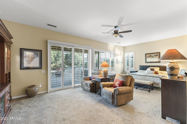 carpeted bedroom featuring access to exterior and ceiling fan