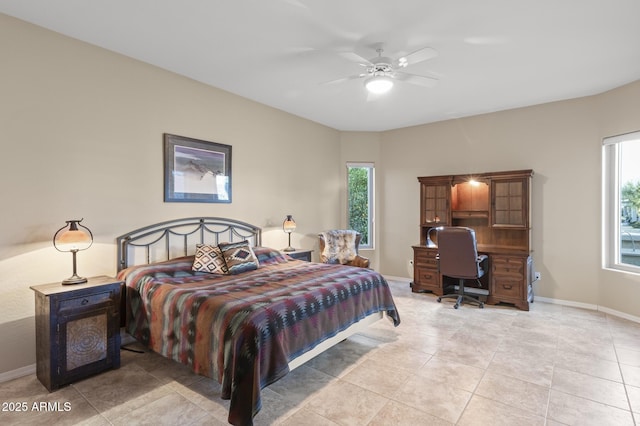 bedroom featuring ceiling fan and multiple windows