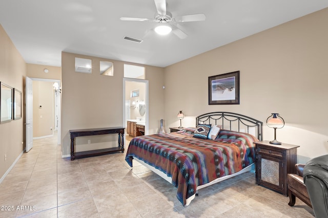 tiled bedroom with ceiling fan and ensuite bathroom