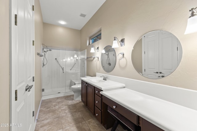 bathroom featuring toilet, an enclosed shower, and vanity