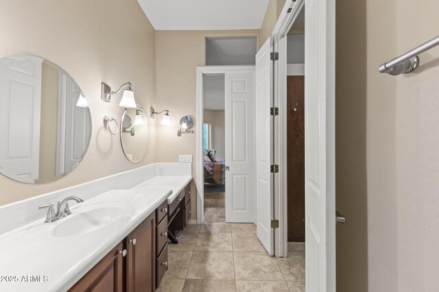 bathroom featuring tile patterned flooring and vanity