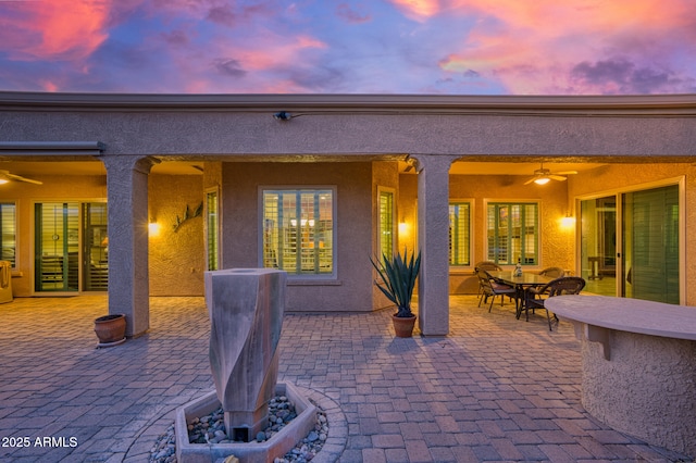 patio terrace at dusk with ceiling fan