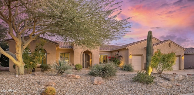 view of front of home with a garage