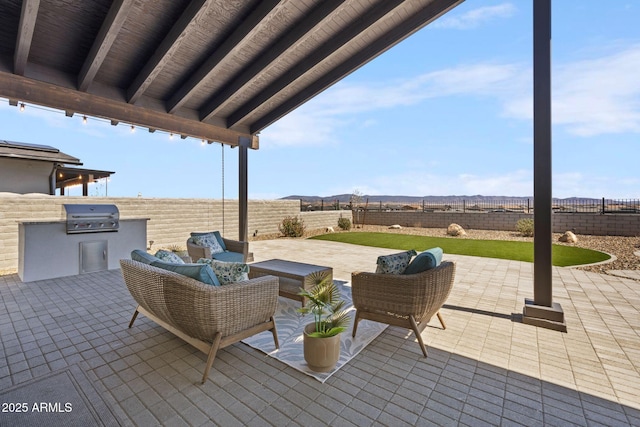 4947 N Mclaury Dr, Prescott Valley, AZ 86314 - view of patio / terrace with an outdoor hangout area, a fenced backyard, and area for grilling