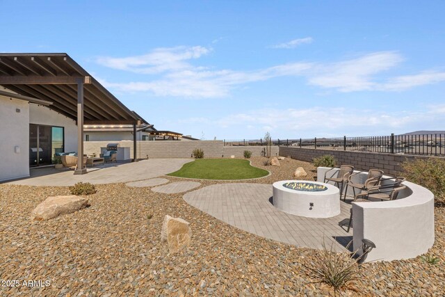 4947 N Mclaury Dr, Prescott Valley, AZ 86314 - view of yard featuring a fenced backyard, a fire pit, and a patio