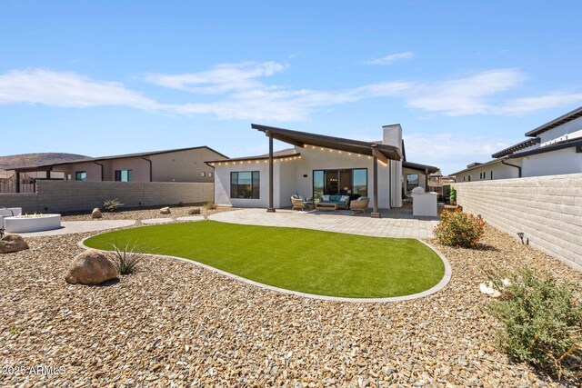 4947 N Mclaury Dr, Prescott Valley, AZ 86314 - rear view of property with a patio, a chimney, a fenced backyard, outdoor lounge area, and stucco siding