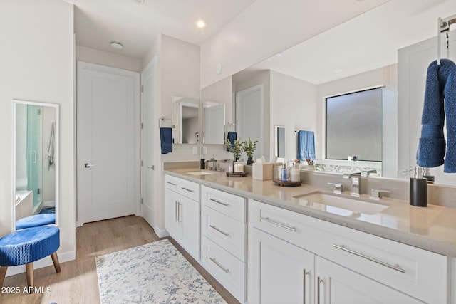 4947 N Mclaury Dr, Prescott Valley, AZ 86314 - full bath featuring baseboards, double vanity, a sink, and wood finished floors