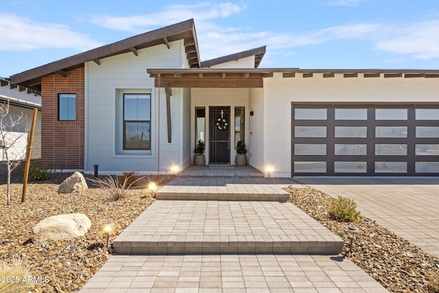 4947 N Mclaury Dr, Prescott Valley, AZ 86314 - contemporary home featuring driveway, a garage, and stucco siding