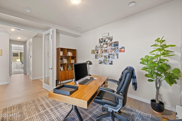 4947 N Mclaury Dr, Prescott Valley, AZ 86314 - home office with baseboards, wood finished floors, and french doors