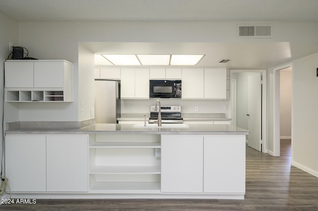 kitchen with appliances with stainless steel finishes, white cabinetry, sink, and dark wood-type flooring