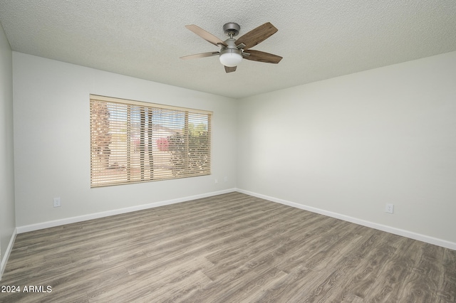 spare room featuring a textured ceiling, hardwood / wood-style floors, and ceiling fan