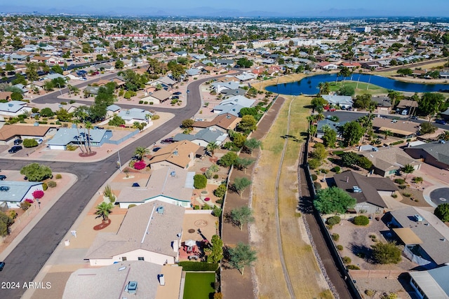 birds eye view of property with a residential view and a water view