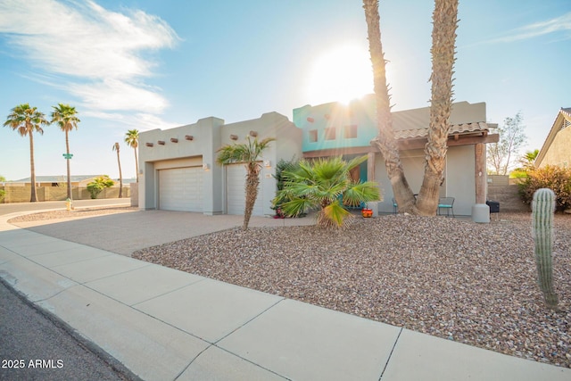 988 W Crooked Stick Dr, Casa Grande, AZ 85122 - southwest-style home with an attached garage, driveway, stucco siding, and fence