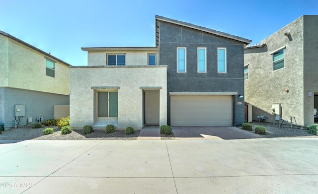 4927 S Tune, Mesa, AZ 85212 - view of front of home featuring concrete driveway, stucco siding, and a garage