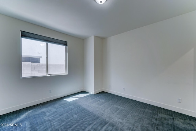 4927 S Tune, Mesa, AZ 85212 - spare room featuring dark carpet and baseboards