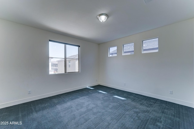 4927 S Tune, Mesa, AZ 85212 - unfurnished room featuring dark colored carpet and baseboards