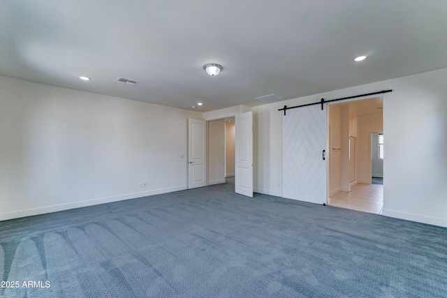 4927 S Tune, Mesa, AZ 85212 - unfurnished bedroom featuring carpet floors, a barn door, and recessed lighting