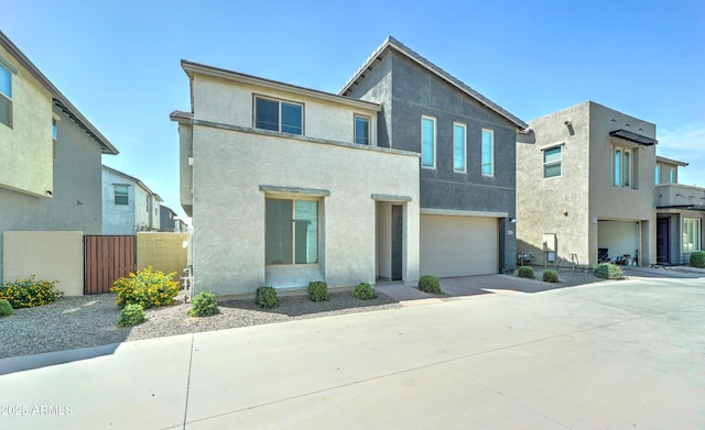 4927 S Tune, Mesa, AZ 85212 - view of front of house with concrete driveway, a garage, and stucco siding