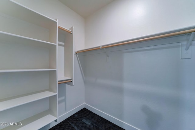 4927 S Tune, Mesa, AZ 85212 - walk in closet with dark tile patterned floors