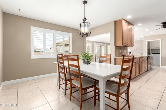 dining room with baseboards, recessed lighting, washer / clothes dryer, and light tile patterned floors