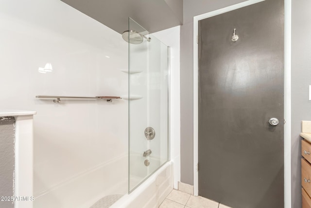 bathroom with vanity, tile patterned flooring, and washtub / shower combination