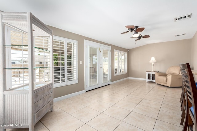 unfurnished room featuring a ceiling fan, french doors, visible vents, and light tile patterned floors