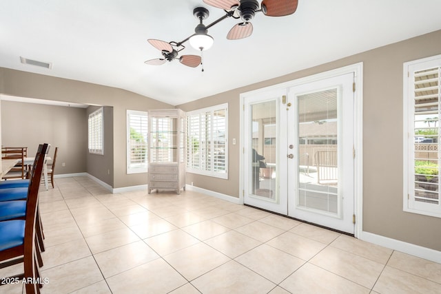 interior space featuring french doors, visible vents, a ceiling fan, and lofted ceiling