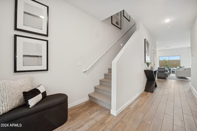 staircase featuring hardwood / wood-style floors