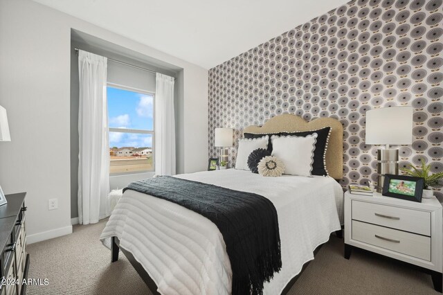 carpeted bedroom featuring lofted ceiling