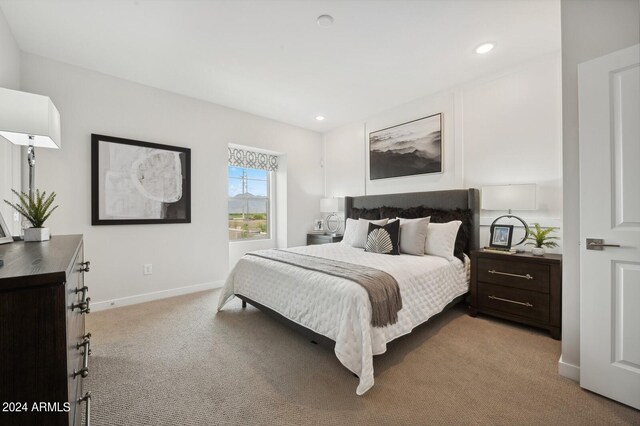 bedroom featuring light colored carpet