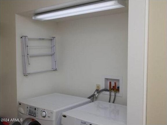 laundry room with separate washer and dryer