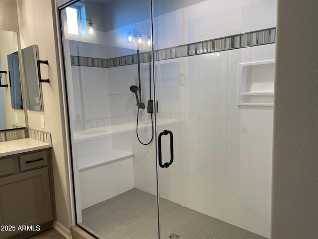 bathroom with vanity and an enclosed shower