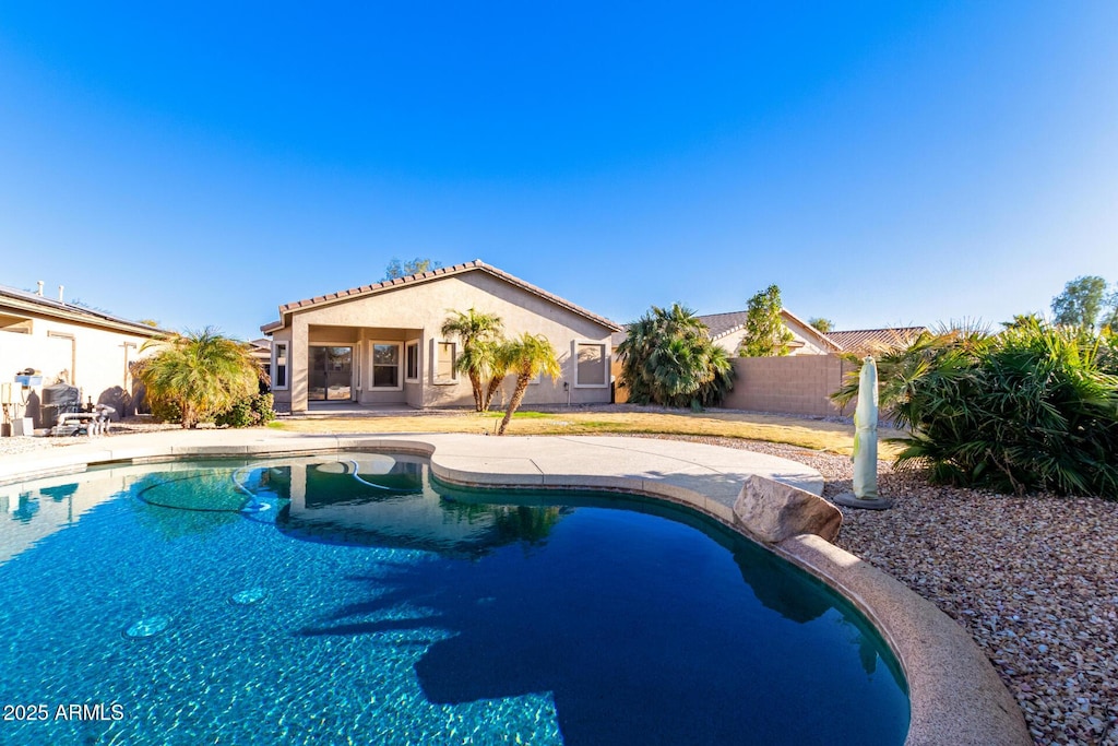 view of swimming pool with a patio area