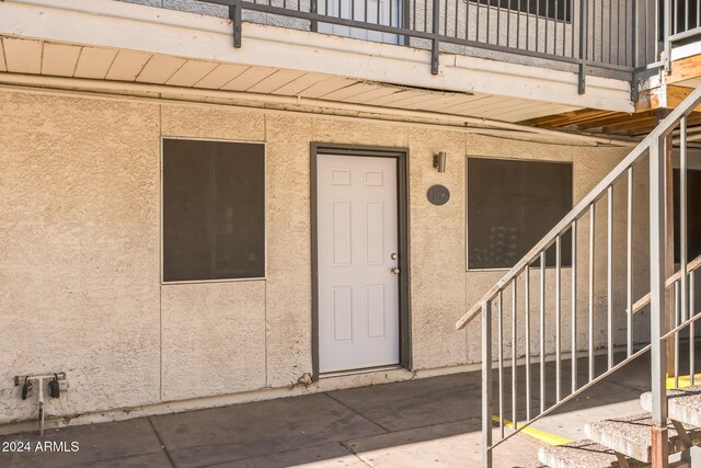 doorway to property featuring a patio area