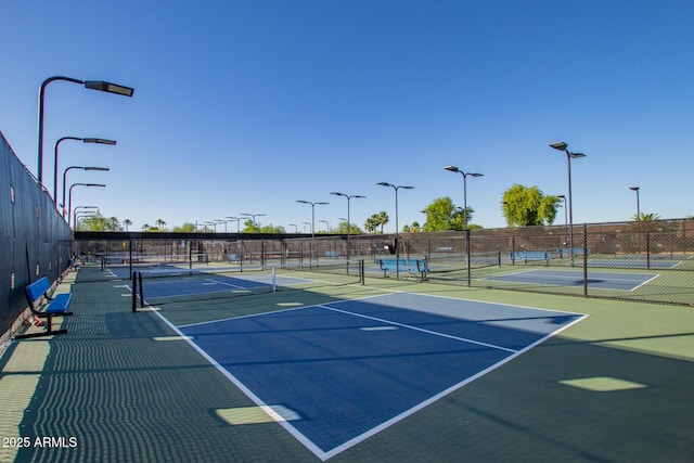 view of sport court featuring community basketball court and fence