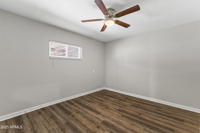 empty room with dark wood-type flooring and ceiling fan