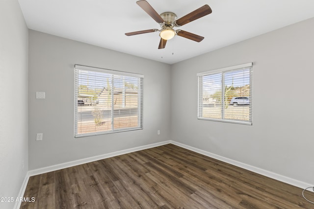 unfurnished room with ceiling fan, dark hardwood / wood-style floors, and a healthy amount of sunlight