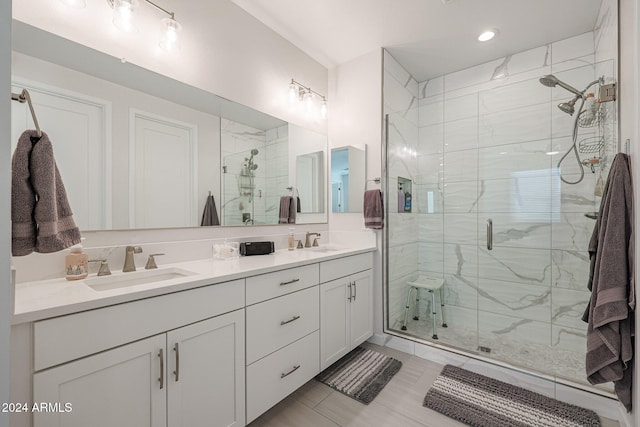 bathroom with tile patterned flooring, vanity, and an enclosed shower