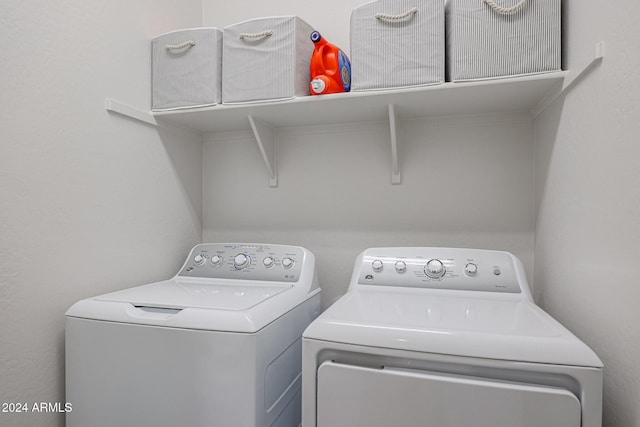 laundry room featuring washing machine and clothes dryer