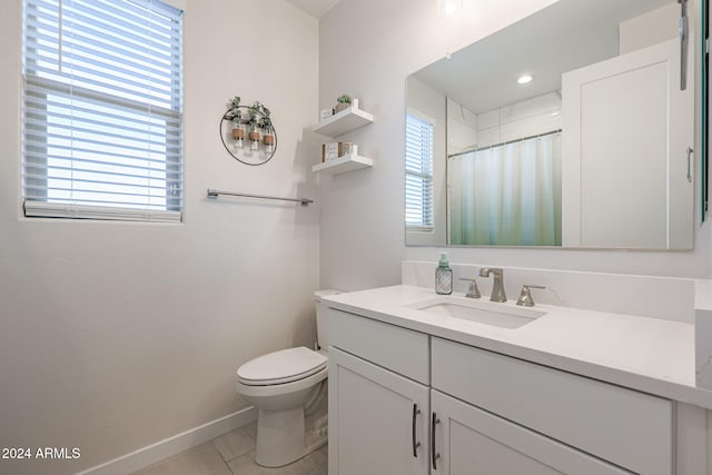 bathroom with tile patterned floors, vanity, toilet, and a shower with shower curtain