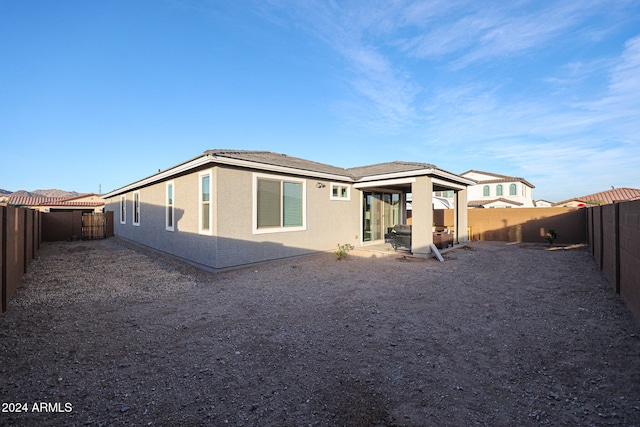 back of house featuring a patio