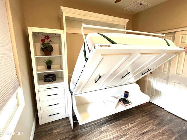 interior space featuring a ceiling fan and wood finished floors