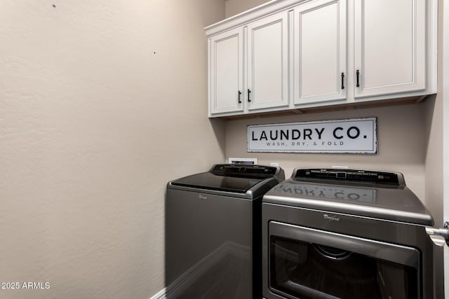 laundry area featuring cabinet space and independent washer and dryer